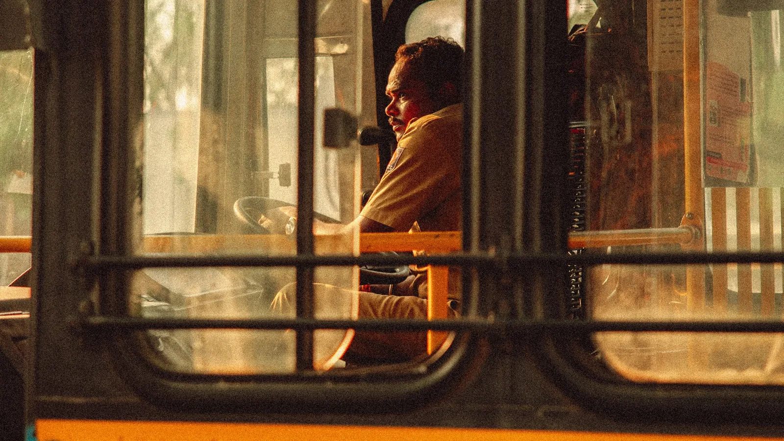 Bus driver looking out from a public transport vehicle in Bengaluru